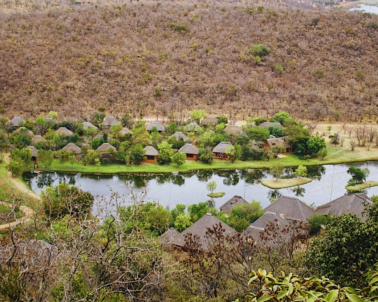 Elevated view of the grounds, dam and accommodation at Intundla Game Lodge & Bush Spa